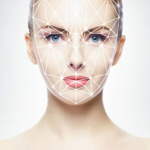 Portrait of attractive woman with a scnanning grid on her face. Face id, security, facial recognition, future technology concept.