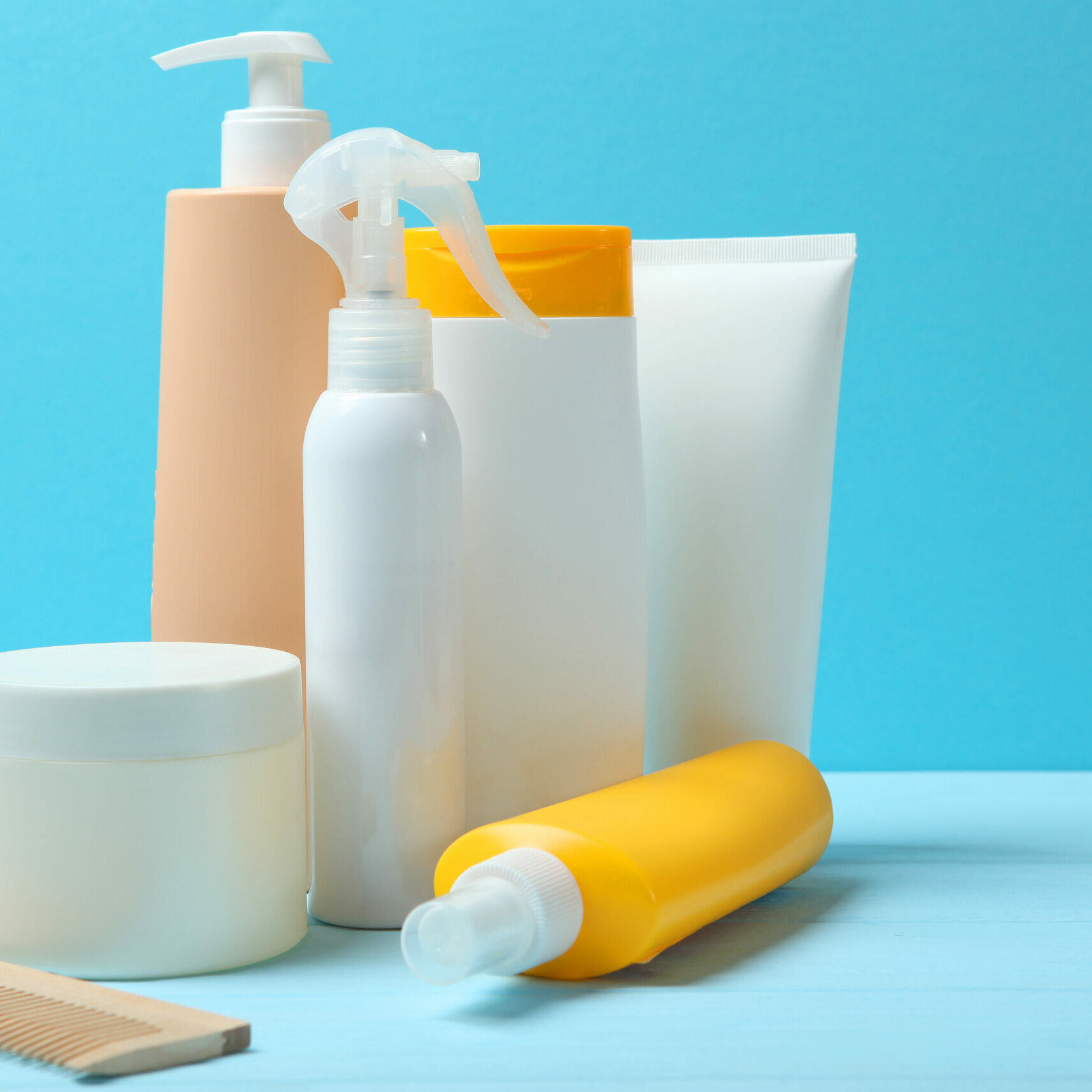 hair care products and a comb on the table.